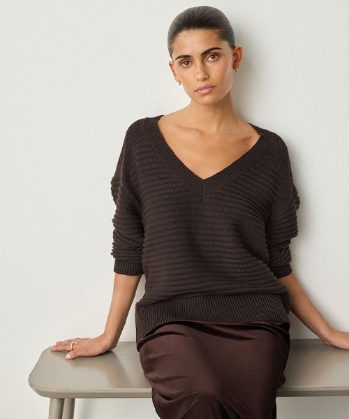 2) A chocolate V-neck knit (medium gauge, not too thin)